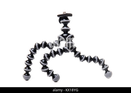 Close up view of a flexible camera tripod isolated on a white background. Stock Photo