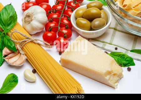 Fettuccine and spaghetti, vegetables with ingredients for cooking pasta Stock Photo
