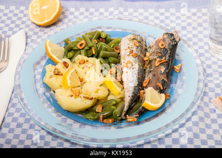 Homemade portuguese mackerel fish meal with potatoes and veggies. Stock Photo