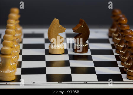 chess knight confrontation head to head, Chess figures on a chessboard Stock Photo