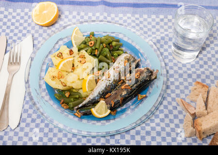 Homemade portuguese mackerel fish meal with potatoes and veggies. Stock Photo