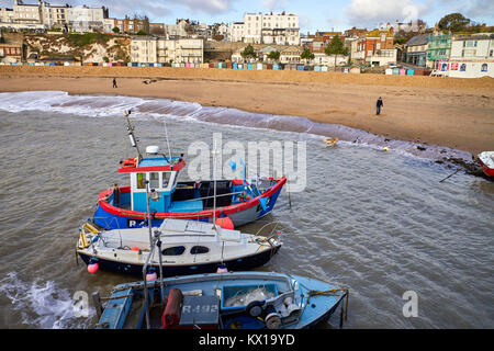 Broadstairs beach with boats in foreground and houses behind Stock Photo