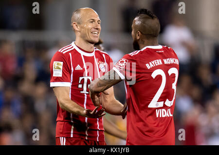 Doha, Qatar. 6th Jan, 2018. Bayern Munich face off against Al-Ahli in a friendly in Doha, Qatar, 6 January 2018. Bayern's Arjen Robben (l) celebrates with Arturo Vidal after his goal raised the score to 3:0. The Bundesliga team is preparing for the remaining season at a Qatar training camp until 7 January 2018. Credit: Sven Hoppe/dpa/Alamy Live News Stock Photo