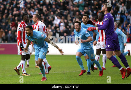 Coventry City's Jordan Willis (left) celebrates scoring his side's first goal of the game during the FA Cup, third round match at the Ricoh Arena, Coventry. Stock Photo