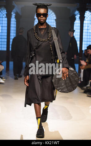 Models on the catwalk during the Tourne De Transmission London Fashion Week Men's AW18 show, held at St George's Church, Bloomsbury, London. Stock Photo