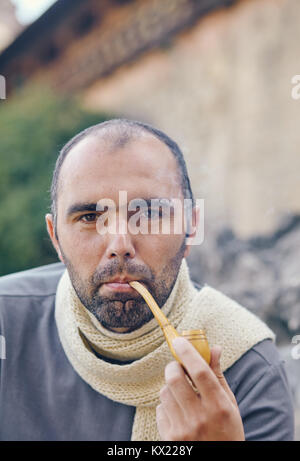 Man with a smoking pipe. Stock Photo