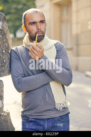 Man with a smoking pipe. Stock Photo