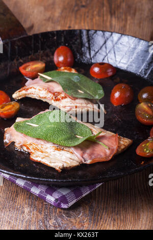 saltimbocca alla romana in an iron pan Stock Photo