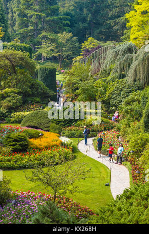 Tourists in Butchart Gardens in Victoria, British Columbia, Canada a National Historic Site of Canada Stock Photo
