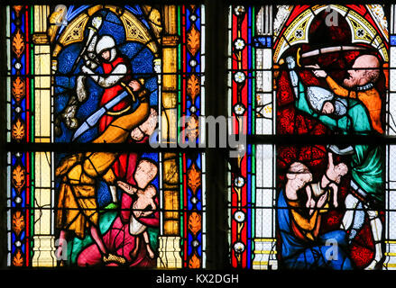 The Massacre of the Innocents, the biblical recount of infanticide by Herod the Great, on a stained glass in the cathedral of Rouen. Stock Photo