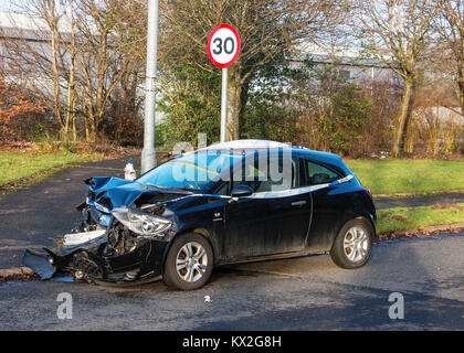 Crashed Car beside Speed Limit Sign Stock Photo