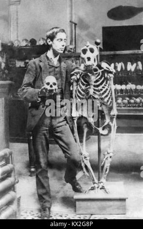 Young H.G. Wells (1866-1946) posing with skull and skeleton. Photo circa mid 1880s, likely while studing biology at the Normal School of Science (later the Royal College of Science in South Kensington) in London under Thomas Henry Huxley. Stock Photo