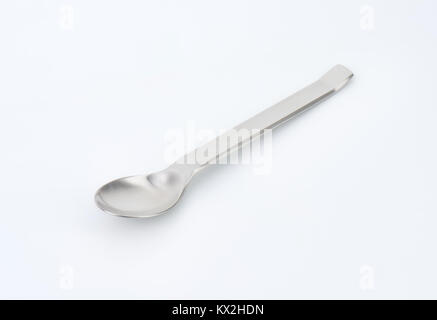 Small empty metal spoon on white background Stock Photo