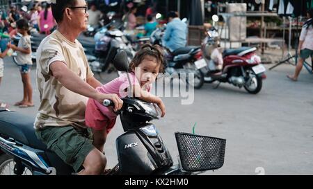 Little Girl and her Daddy Takeo Cambodia Market Area Third World Shopping Out of the Way Places Stock Photo