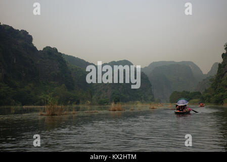 Paddling on the Tam Coc river, Vietnam Stock Photo
