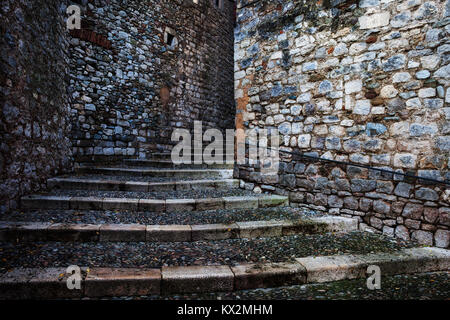 Medieval stone walls and cobblestone stairs in Old Town of Girona city in Catalonia, Spain Stock Photo