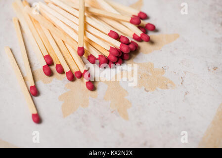 Matches on tile or ceramic background with copy space. Stock Photo