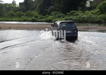 Car crossing river near Drake Bay Costa Rica Osa Peninsula Stock Photo