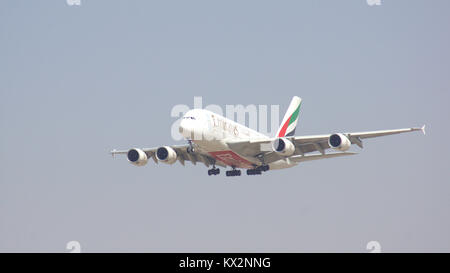 DUBAI, UNITED ARAB EMIRATES - APRIL 1st, 2014: Airbus A380 from Emirates Airlines approaching Dubai Airport DXB, landing of A6-EDU Stock Photo