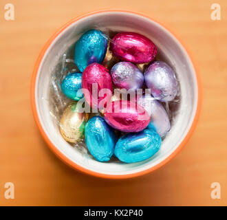 Colored chocolate eggs inside a cup Stock Photo