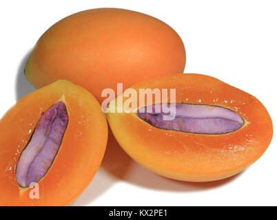 Close-up of Fresh ripe Whole and cut in half with seed Marian Plum fruits Isolated on White Background Stock Photo