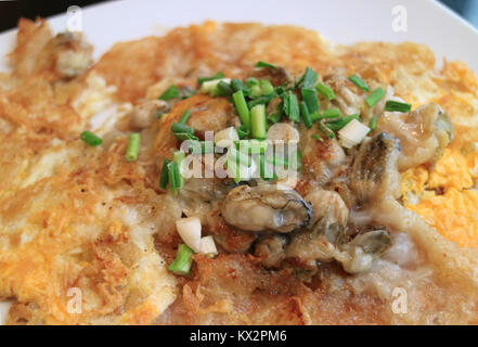 Close-up of fried oysters crispy omelette severed on white plate Stock Photo