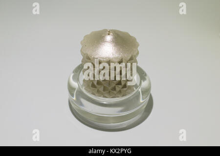Gray wax candle in a glass base isolated with white background. Stock Photo