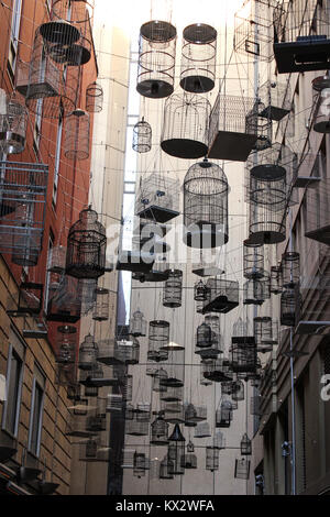 artistic installation 'Forgotten Songs', hanging empty bird cages Stock Photo