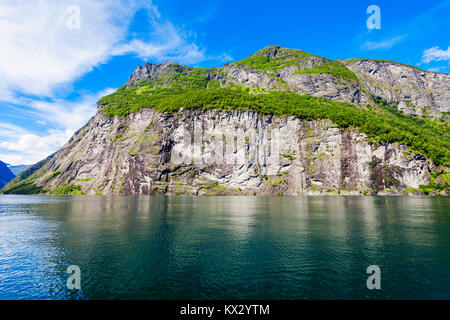 Geirangerfjord mountain view from tourist boat. Geirangerfjord located near the Geiranger village in Norway Stock Photo
