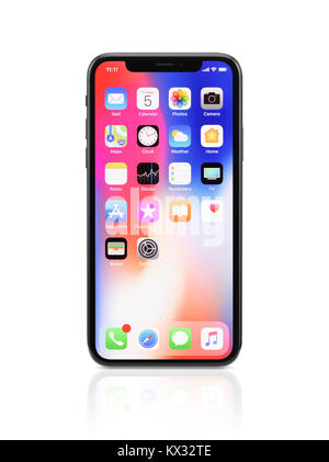 Apple iPhone X, large screen smartphone, product still life with desktop and app icons on its colorful red blue display. The phone is isolated on whit Stock Photo