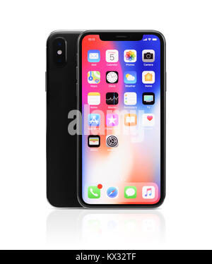 Apple iPhone X, large screen smartphone with dual rear camera, product still life with desktop and app icons on its colorful red blue display, isolate Stock Photo
