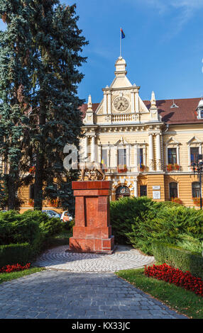 Statue of Romulus and Remus being suckled by a she-wolf by the City Hall in Brasov, a city in central Transylvania region of Romania on a sunny day Stock Photo