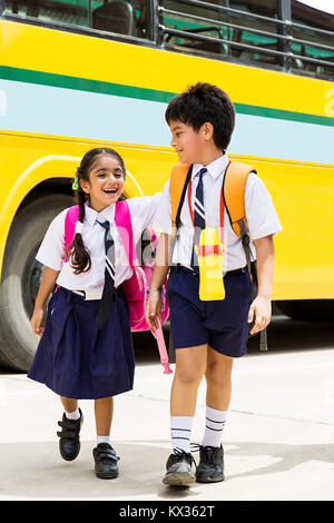 Happy 2 Indian School Kids Boy And Girl Friend Walking Together Stock Photo