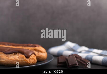 home backed eclairs with chocolate Stock Photo