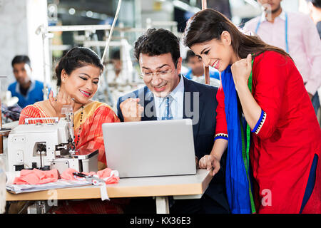 Ladies Workers Tailor s and Supervisor Laptop Working Meeting Sewing-Factory Stock Photo