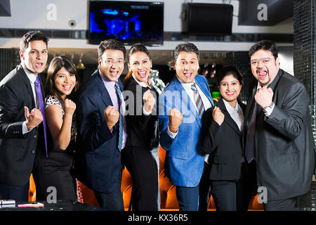 Group Business Partners Fist Victory Success Celebration Party In-Hotel Stock Photo