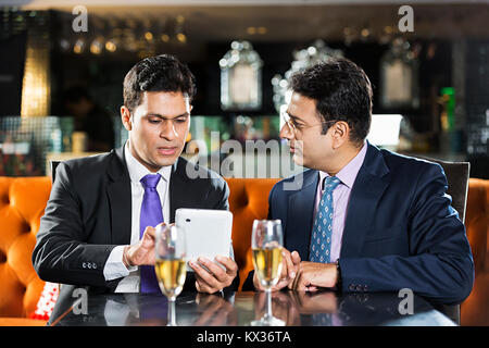 Two Business People Colleague Sitting Restaurant Discussion Meeting Project Digital-Tablet Stock Photo