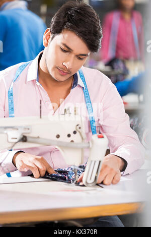 Indian Workers Tailor And Manager In Sewing Factory Stock Photo