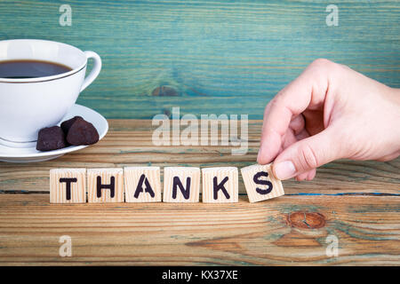 thanks. Wooden letters on the office desk, informative and communication background Stock Photo