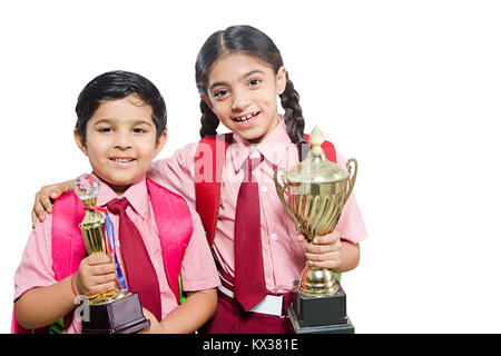 2 Indian School Kids Friend Students Showing Victory Trophy Success Stock Photo