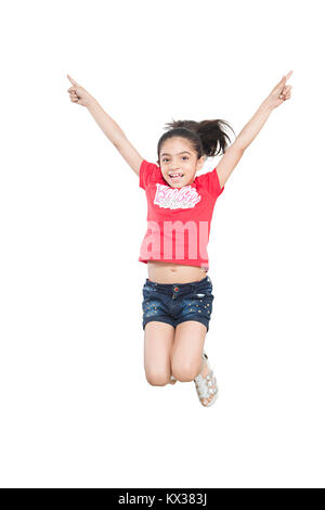 Happy 1 Indian kid Girl Jumping having Fun Enjoy Cheerful Stock Photo