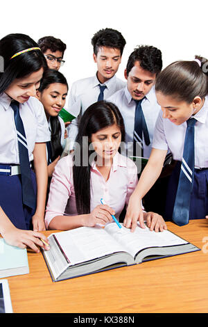 Indian Group School Students And Teacher Book Study Education Class Stock Photo