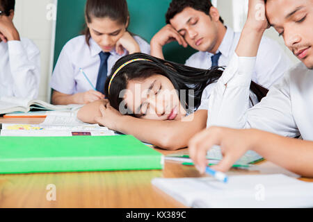 Indian School Young Girl Students Sleeping In Class Careless Education Stock Photo