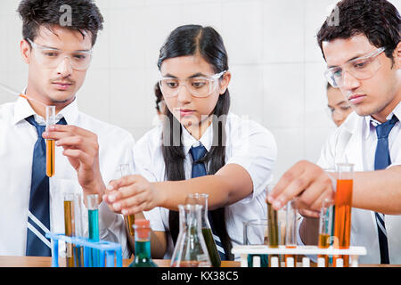Lab partners doing chemistry experiment in high school science class Stock Photo