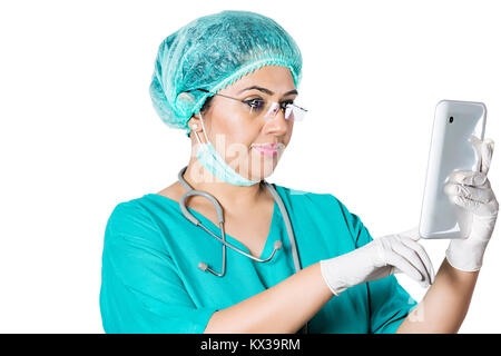Indian Surgeon Female Doctor Reading Messaging Digital Tablet Stock Photo