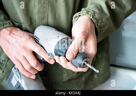 Carpenter keeps electric drill Stock Photo