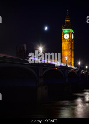 London cityscape with illuminated Elizabeth Tower aka Big Ben and the Westminster Bridge over the River Thames  at night Stock Photo