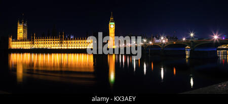 London cityscape with illuminated Palace of Westminster, Elizabeth Tower aka Big Ben and the Westminster Bridge over the River Thames  at night Stock Photo