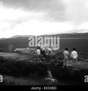 The title contains non-readable characters that prevent accurate ...