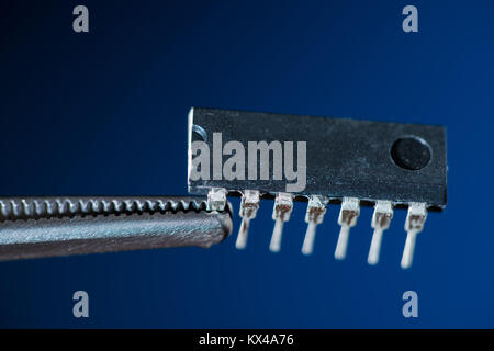 Electronic chip isolated on dark blue Stock Photo